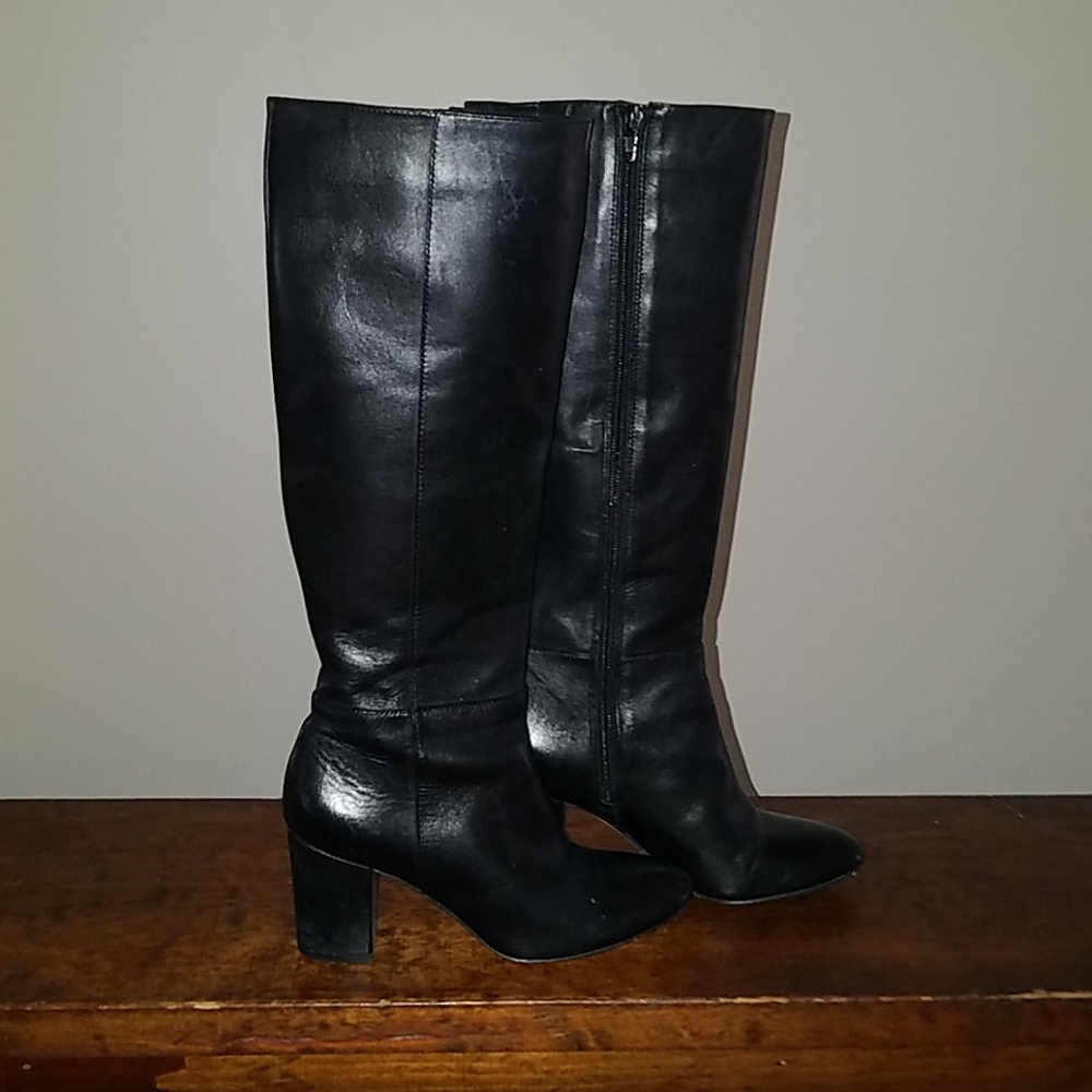 Black leather knee high heeled boots